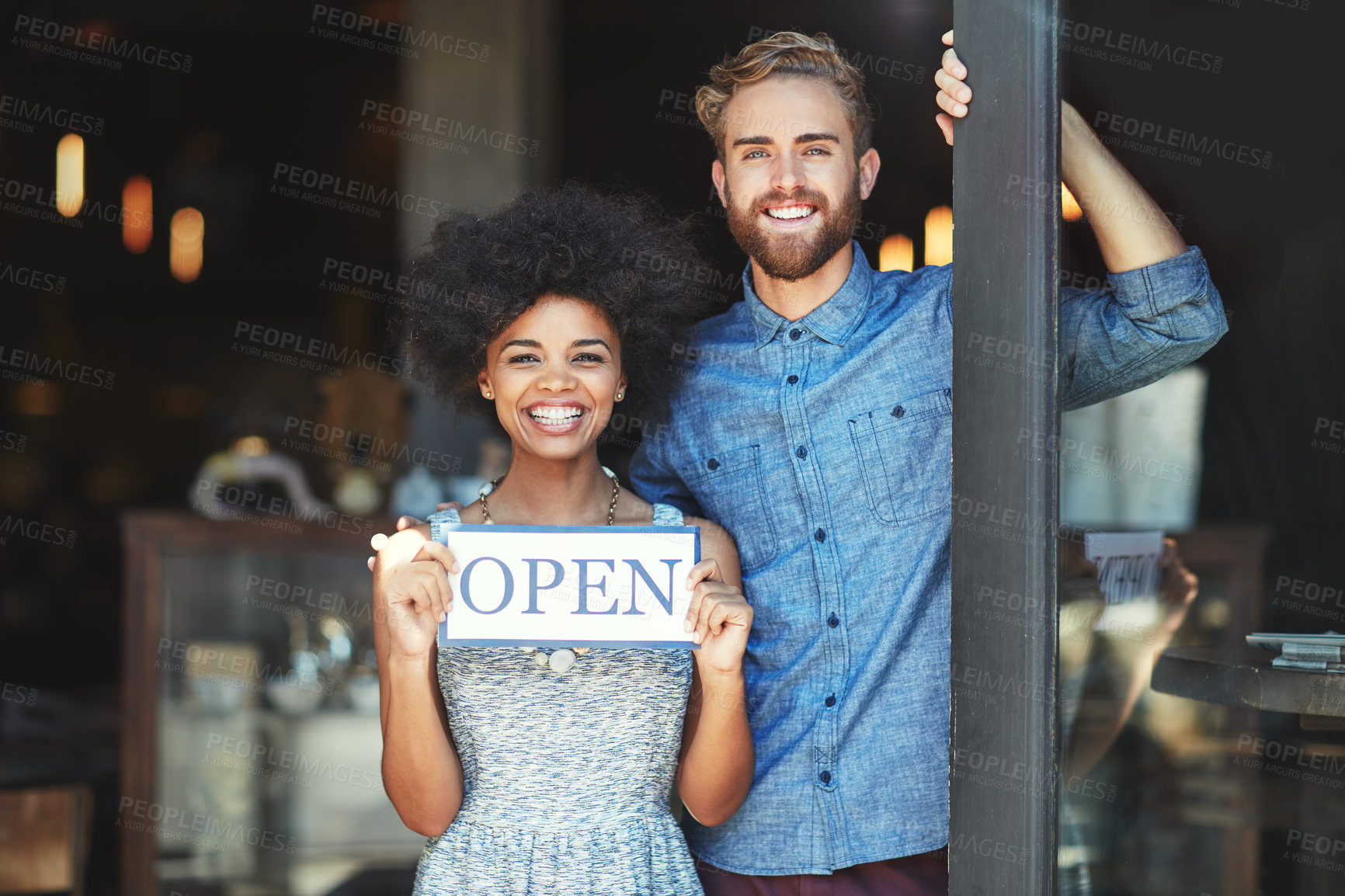 Buy stock photo Coffee shop, open and couple portrait as small business owner or team in partnership with pride. Smile of a man and woman with signage, diversity and welcome sign as waiter and barista of restaurant