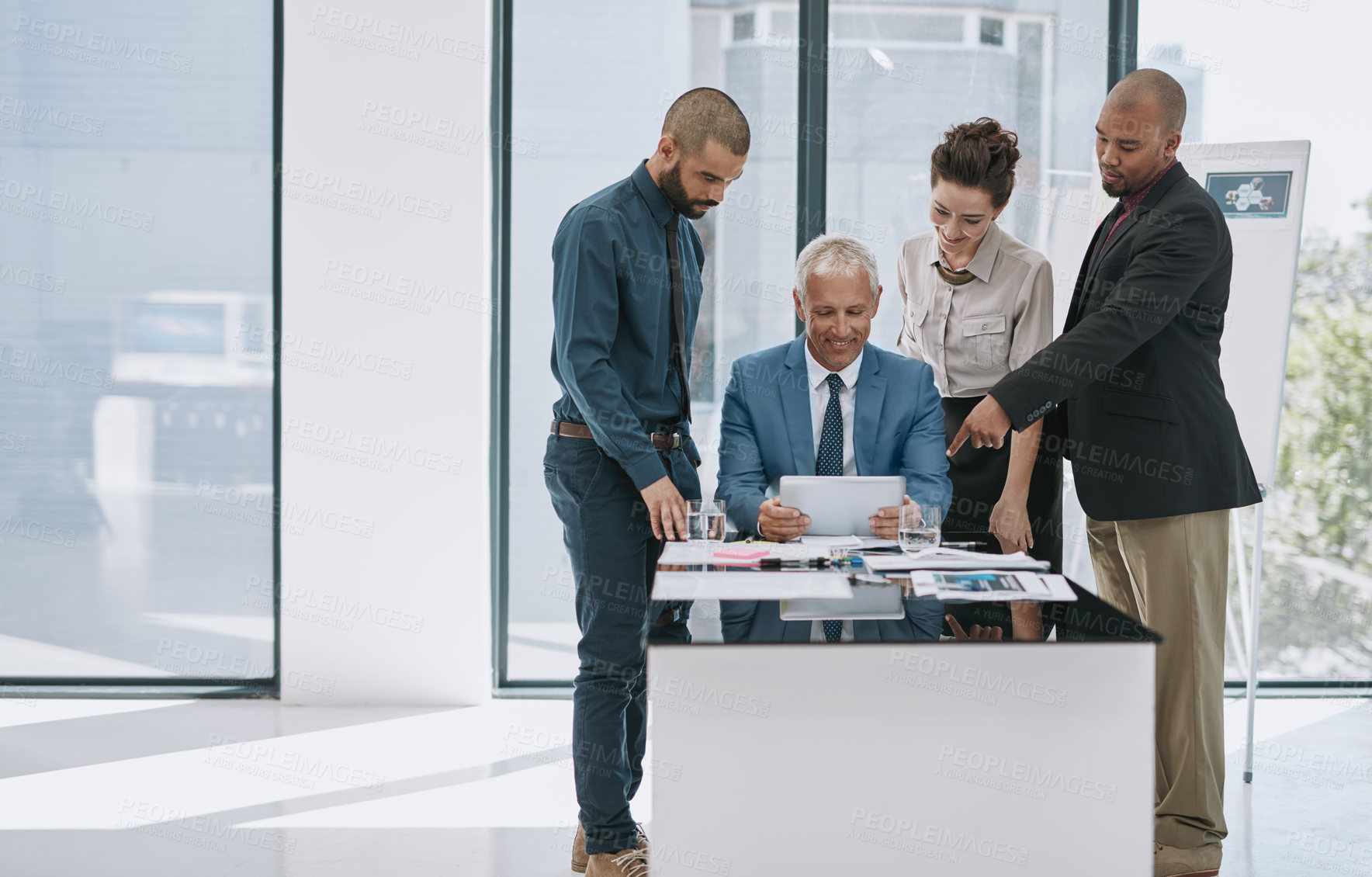 Buy stock photo Cropped shot of a group of businesspeople in the boardroom