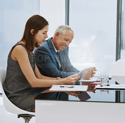 Buy stock photo Cropped shot of two businesspeople in the boardroom