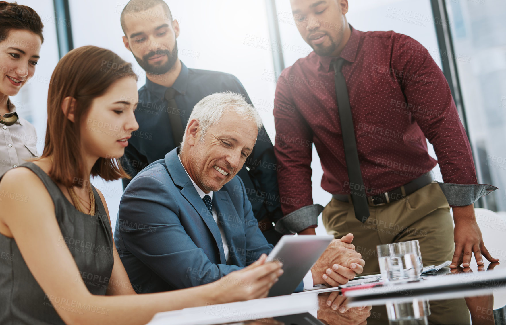 Buy stock photo Cropped shot of a group of businesspeople in the boardroom