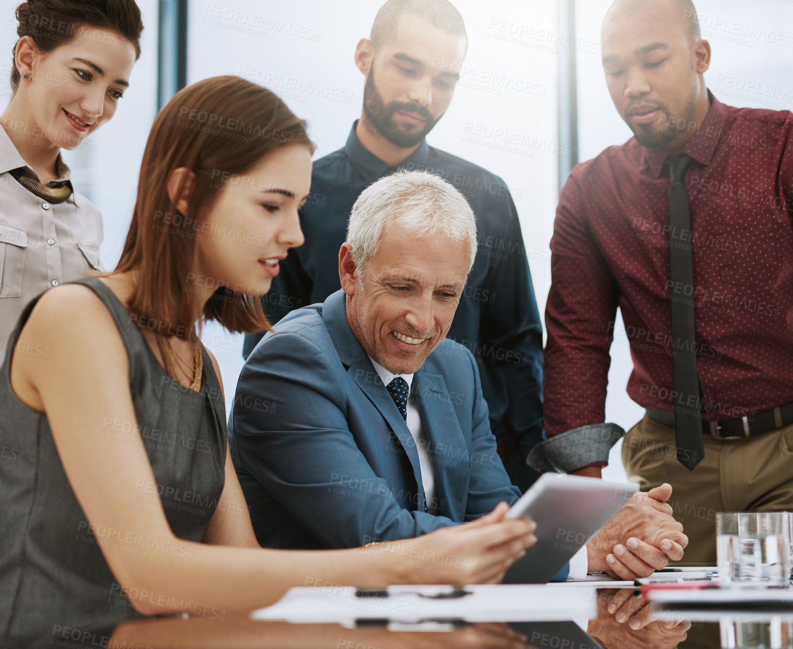 Buy stock photo Cropped shot of a group of businesspeople in the boardroom