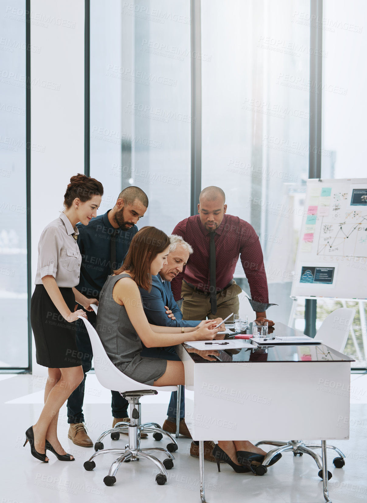 Buy stock photo Full length shot of a group of businesspeople in the boardroom