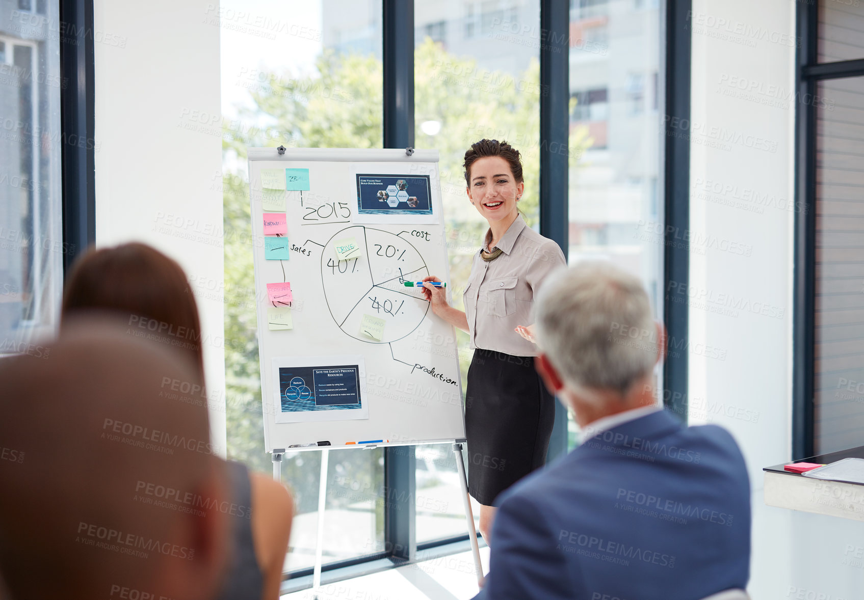 Buy stock photo Shot of a group of colleagues having a presentation at work