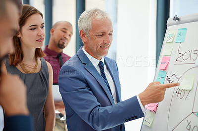 Buy stock photo Shot of a group of colleagues working on a project together