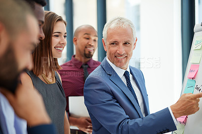 Buy stock photo Shot of a group of colleagues working on a project together