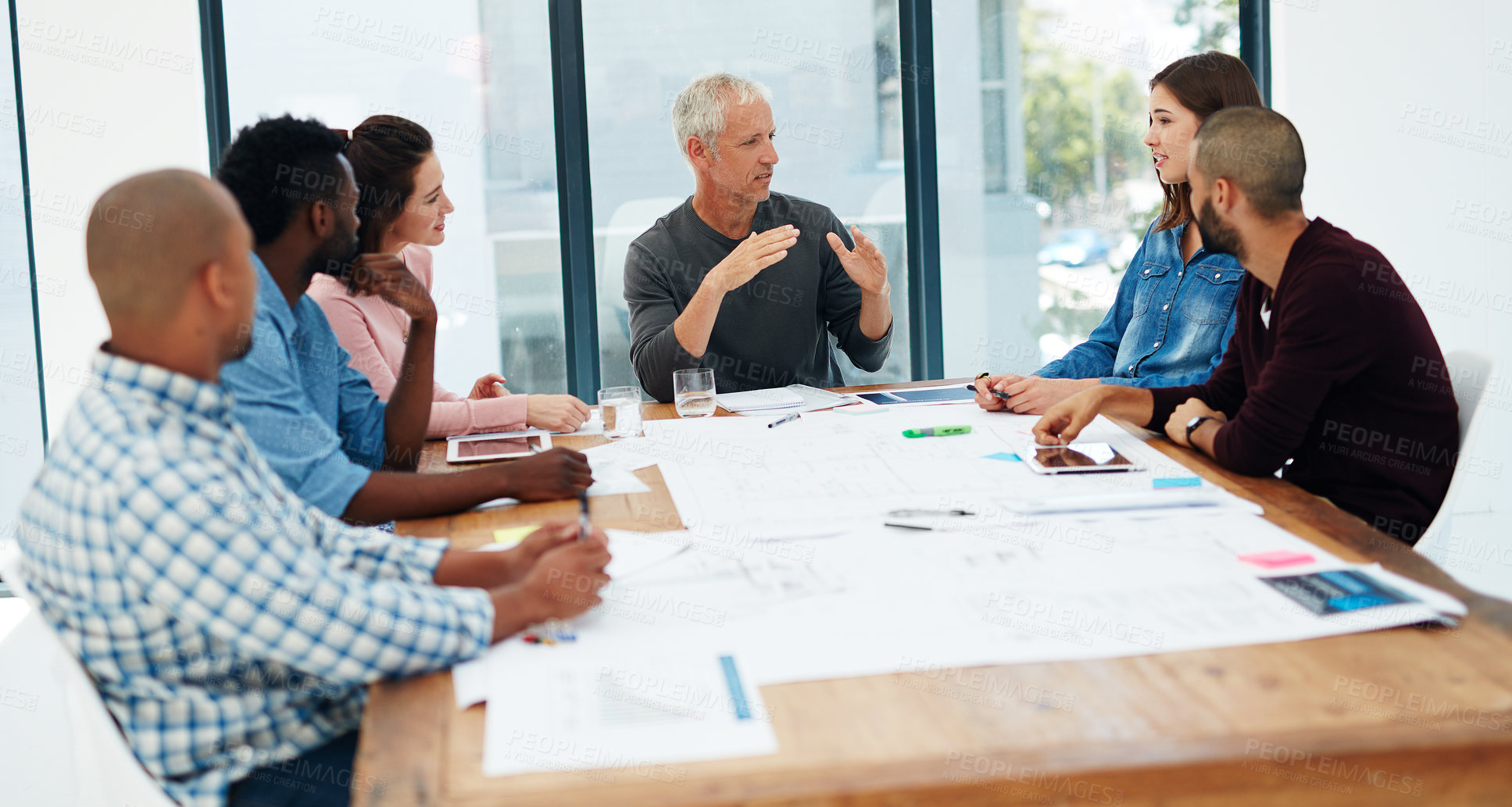 Buy stock photo Cropped shot of a group of architects in the boardroom