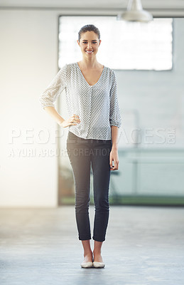 Buy stock photo Full length portrait of a young female designer standing with her hand on her hip in the office