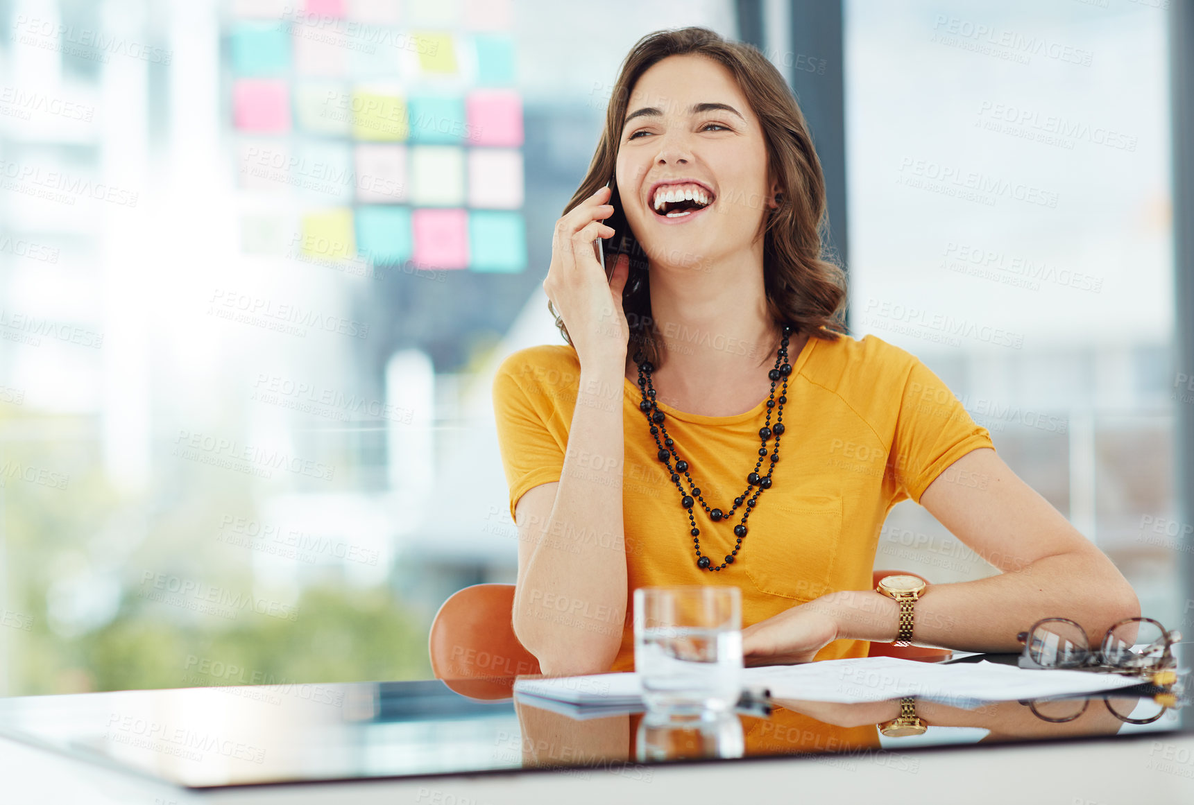 Buy stock photo Happy woman in business, phone call and laughing with communication in office with conversation and contact. Positivity, professional female person networking or casual discussion on mobile 