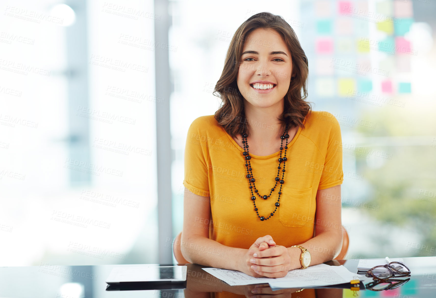 Buy stock photo Cropped portrait of a young businesswoman working in her office