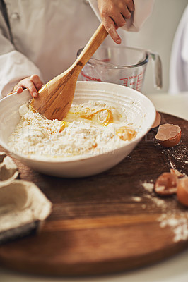 Buy stock photo Cropped shot of a mother and her son baking in the kitchen