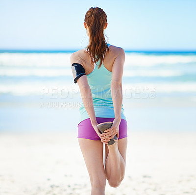 Buy stock photo Fitness, wellness or sports woman stretching leg for exercise warm up, cardio workout or training at beach sand. Back view, runner or athlete girl with health hamstring stretch at ocean with blue sky