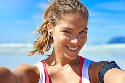 Buy stock photo Fitness, selfie and happy woman at beach workout, exercise and healthy lifestyle with music. Portrait female athlete, ocean and taking photograph for social media, sports wellness and summer training