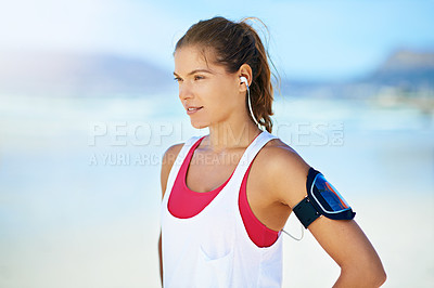 Buy stock photo Shot of a young woman working out on the beach