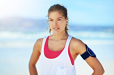 Buy stock photo Shot of a young woman working out on the beach