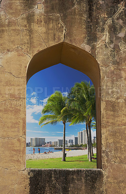 Buy stock photo Tropical, window and travel with palm tree on beach for holiday destination, summer and Hawaii. resort, tourism and vacation with people and buildings on Honolulu island for adventure and explore