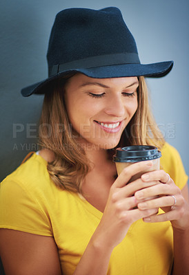 Buy stock photo Shot of a young woman drinking a takeout coffee against a grey background