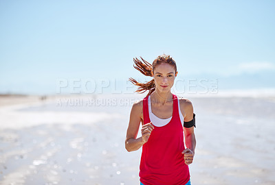 Buy stock photo Cropped shot of a young woman running on the beach