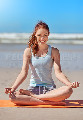 Buy stock photo Full length shot of a young woman meditating on the beach