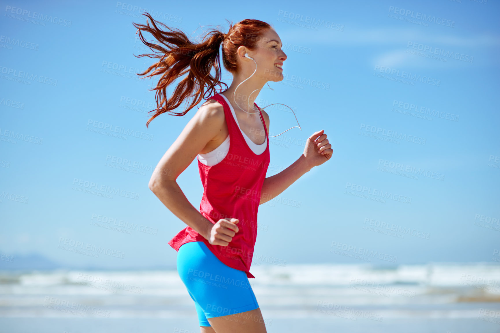 Buy stock photo Cropped shot of a young woman running on the beach