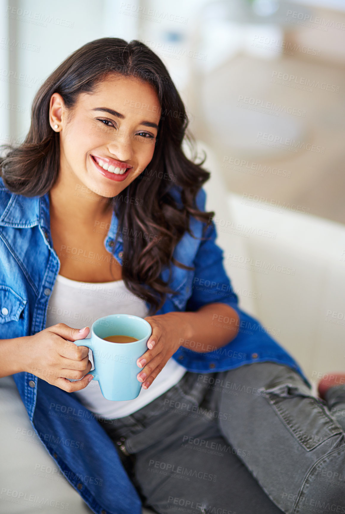 Buy stock photo Woman, portrait and smile with beverage in living room on sofa for relax with weekend in home. Happy, apartment and drink with tea mug or hot cocoa in morning with warm coffee, couch and positive