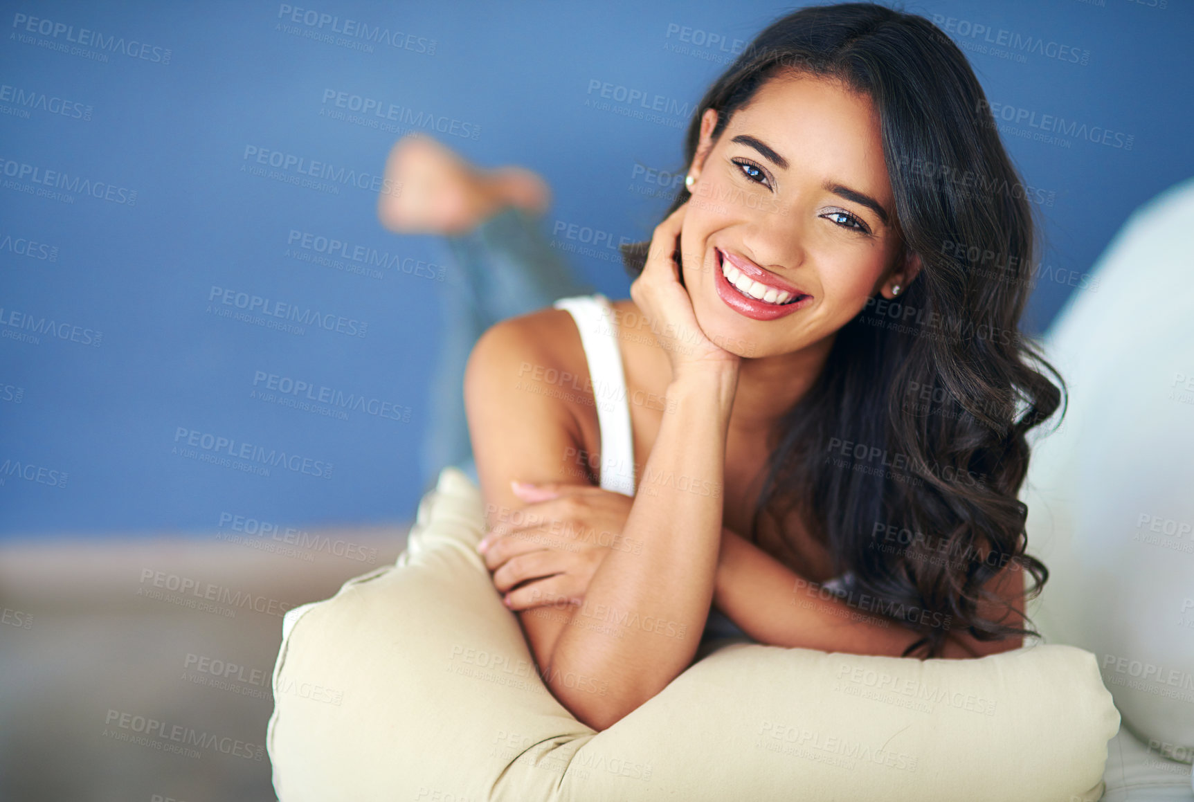 Buy stock photo Portrait, woman and lying on sofa, relax and happy in living room being calm. Confident female, girl and happiness to rest, with smile and peaceful for weekend, break and with joy on couch in lounge.
