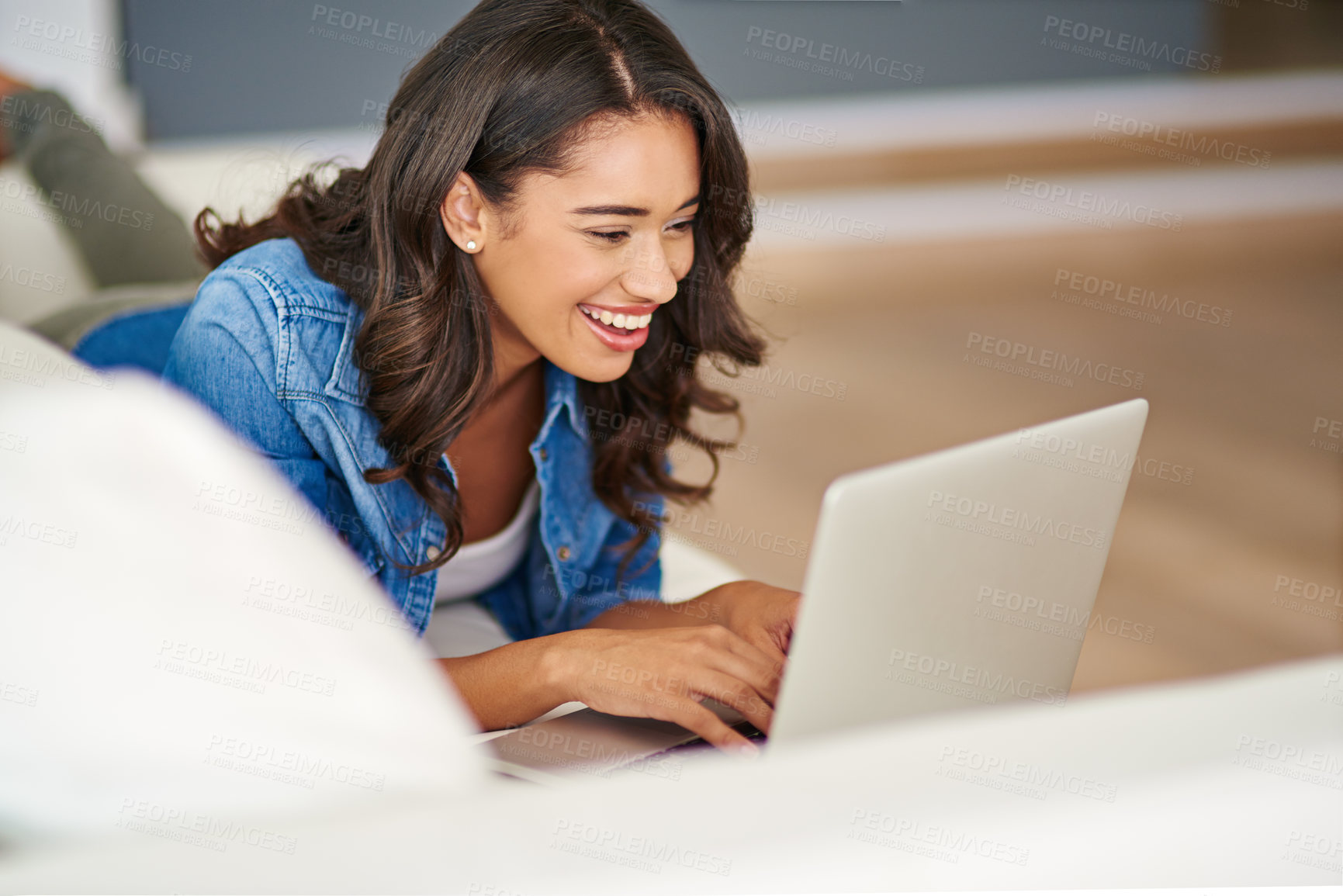 Buy stock photo Laptop, happy woman and laughing on sofa in home for funny blog, comedy movie or streaming show on app. Computer, smile and girl online for meme, reading joke and watch video on social media platform