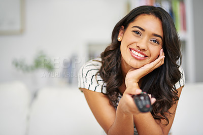 Buy stock photo Movie, happy and woman watching tv to relax with freedom on a weekend a home with an online subscription. Smile, television and excited young girl enjoys streaming a tv show, film or movies on remote