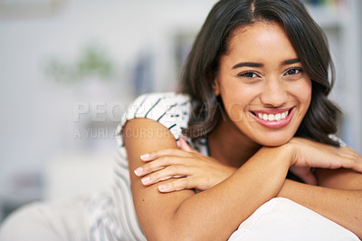 Buy stock photo Portrait, black woman and smile on sofa, happy and relax in lounge being peaceful and content. Young female, confident girl and happiness to rest, calm or break for weekend, joy or on couch in lounge