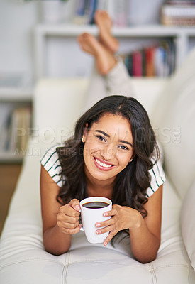 Buy stock photo Portrait, woman and smile on sofa with coffee, relax and comfort on weekend at home. Female person, happy and warm beverage on couch for peace, wellness and morning in Brazil apartment for rest