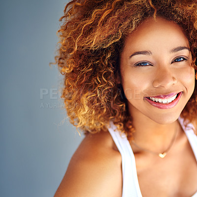 Buy stock photo Cropped shot of a young woman posing against a grey background