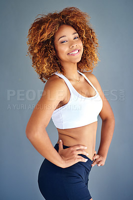 Buy stock photo Cropped shot of a sporty young woman posing against a grey background