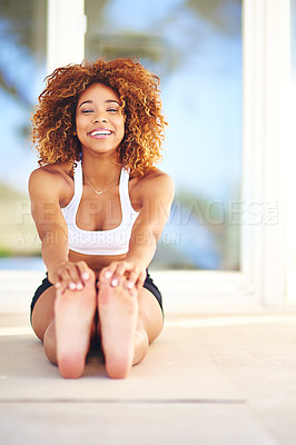 Buy stock photo Portrait of a sporty young woman practising her yoga routine