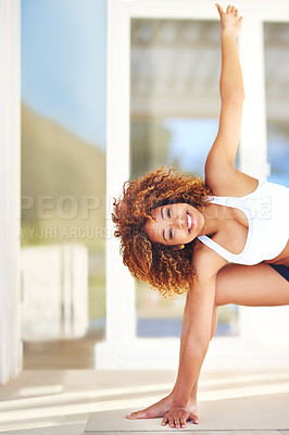 Buy stock photo Portrait of a sporty young woman practising her yoga routine