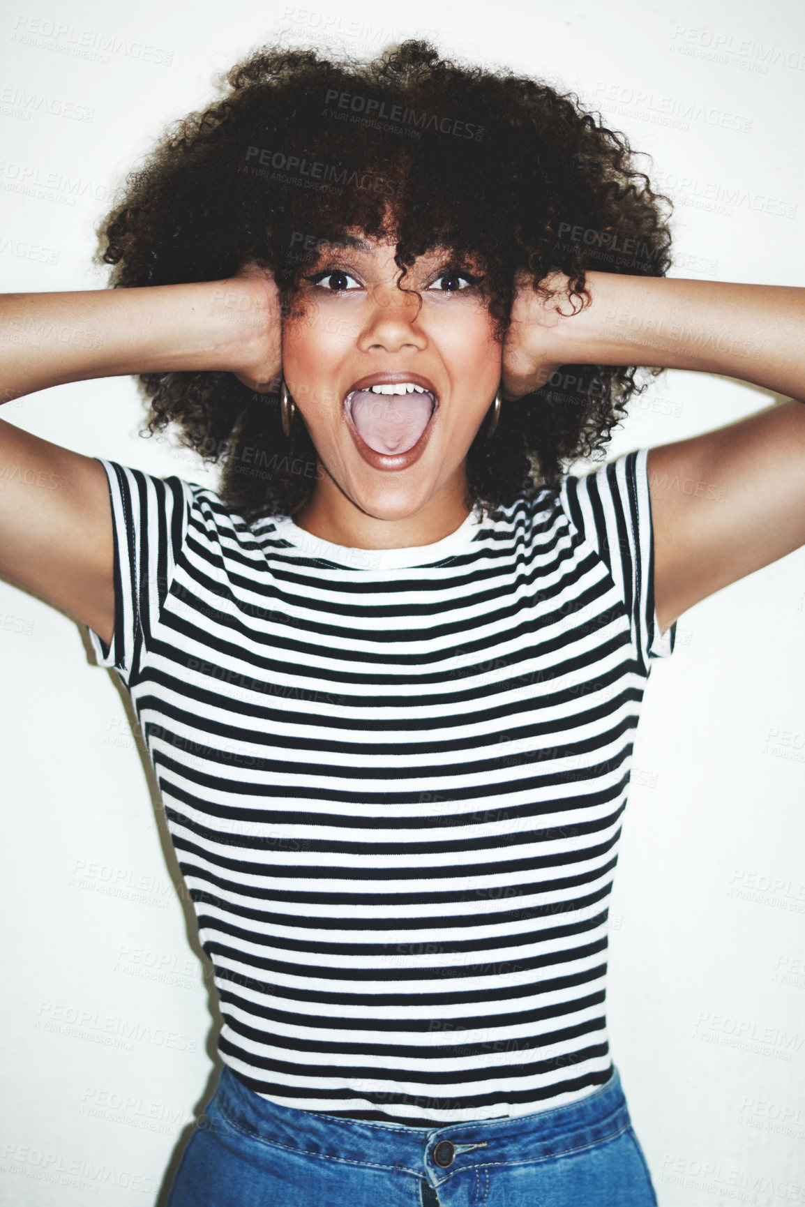 Buy stock photo Studio shot of an excited young woman posing against a gray background
