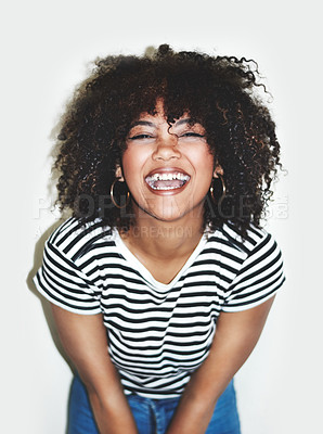 Buy stock photo Afro, laughing and portrait of woman in studio on white background for comedy, humor or joke. Emotion, funny or reaction and face of happy person satisfied with body language or positive joy