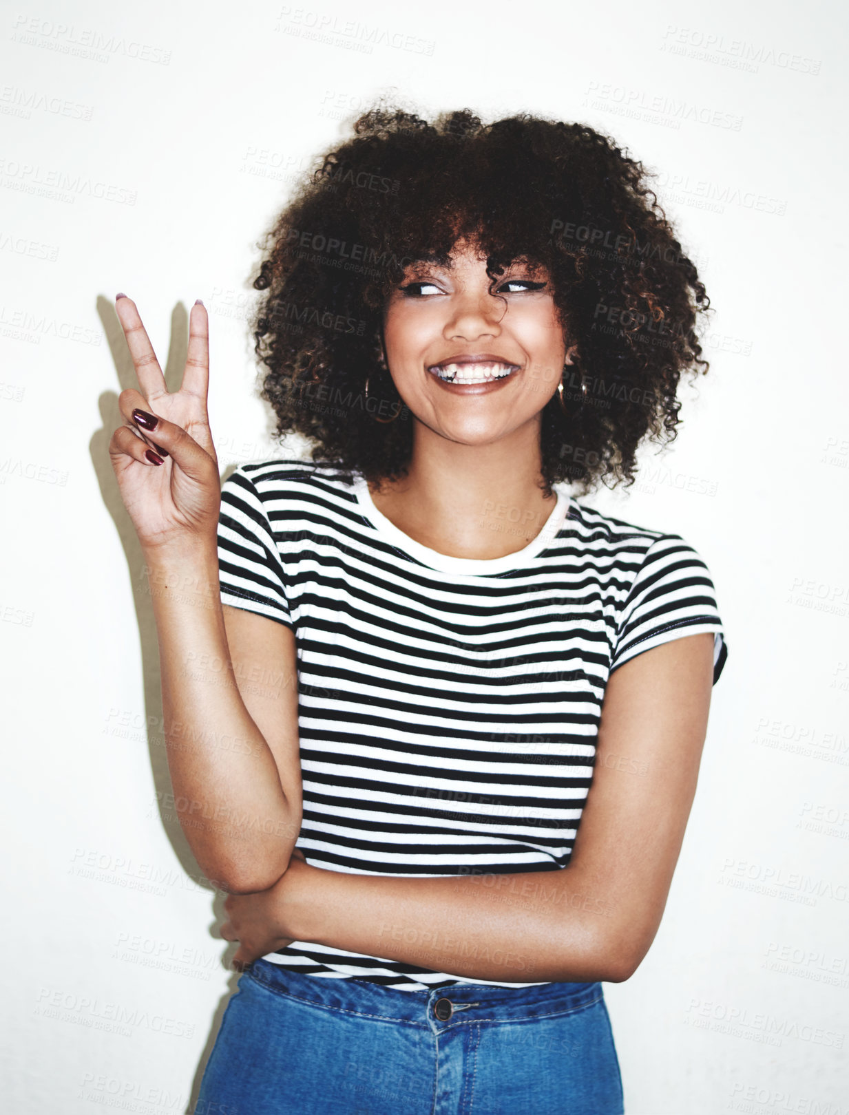 Buy stock photo Peace, sign and black woman with smile, excited and casual against a gray studio background. Young female, hand gesture and girl being silly, goofy and playful with trendy, edgy and stylish look.