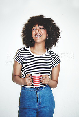 Buy stock photo Studio shot of an attractive young woman enjoying a beverage against a gray background