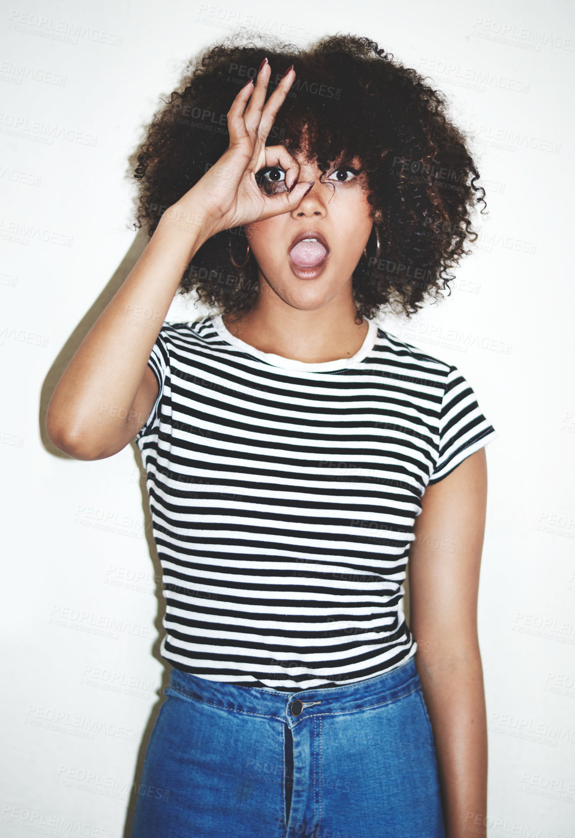 Buy stock photo Portrait, girl and hand binoculars with shocked, white background and fashion for style or trendy clothes. Female person, gesture and expression as surprised, curious or playful in studio backdrop