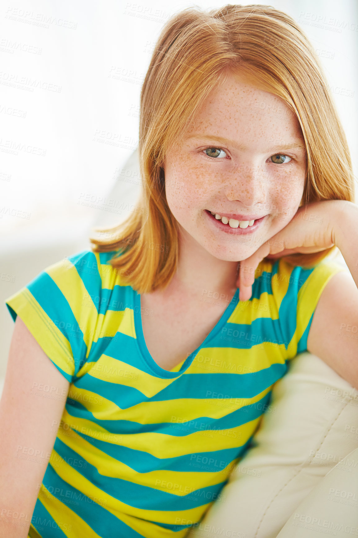 Buy stock photo Portrait of a little girl relaxing on the sofa at home