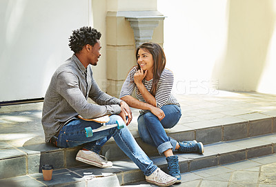 Buy stock photo Shot of a young skater couple hanging out in the city