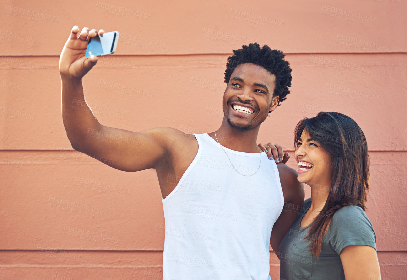 Buy stock photo Shot of a young couple taking a selfie together