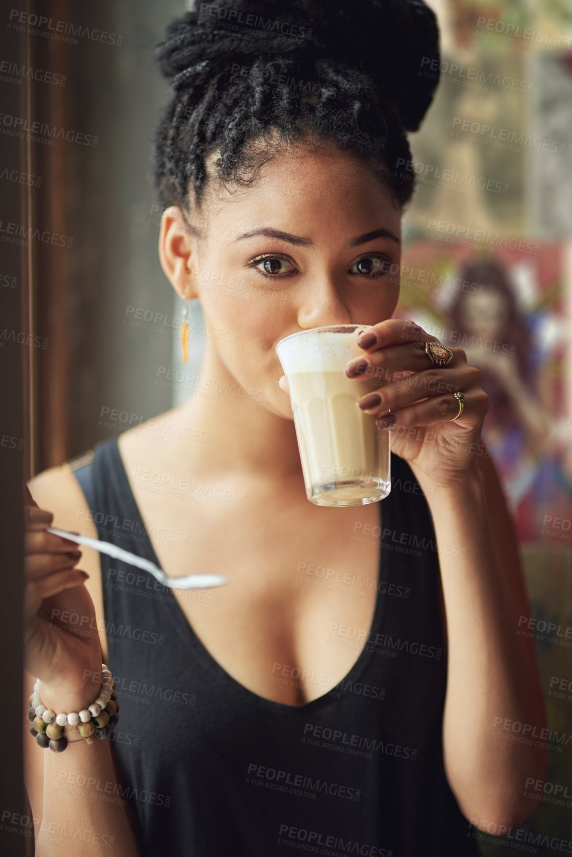 Buy stock photo Cropped portrait of an attractive young woman sitting in a coffee shop