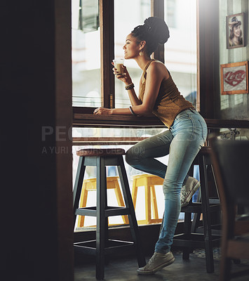 Buy stock photo Full length shot of an attractive young woman sitting in a coffee shop