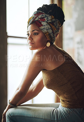 Buy stock photo Cropped shot of an attractive young woman sitting by the window