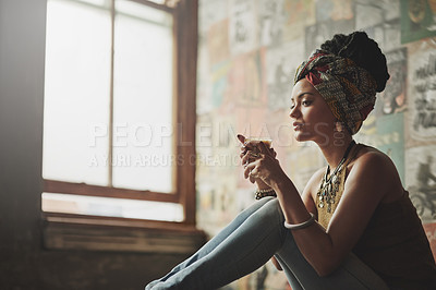 Buy stock photo Cropped shot of an attractive young woman drinking coffee