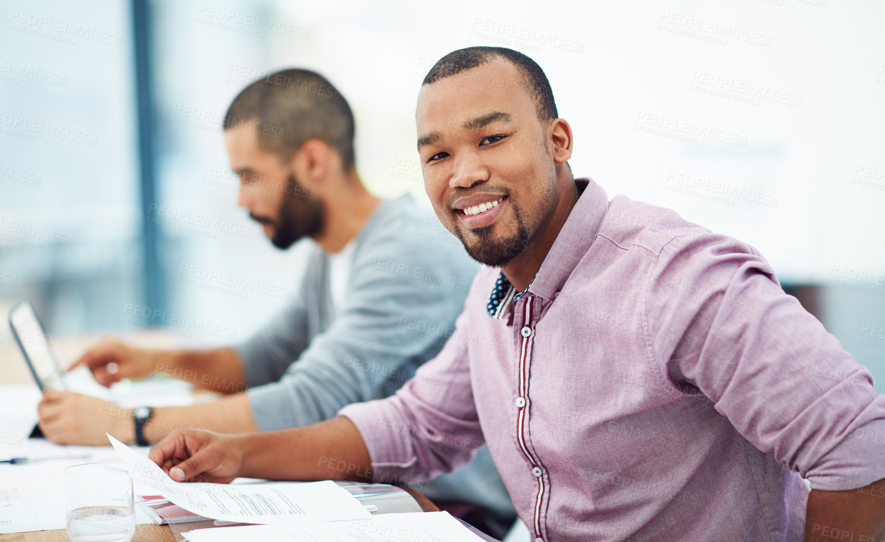 Buy stock photo Businessman, documents and smile at desk with coworker in financial planning, analysis and strategy. Black man, happy and finance data on paper at desk for budget, teamwork or corporate partnership