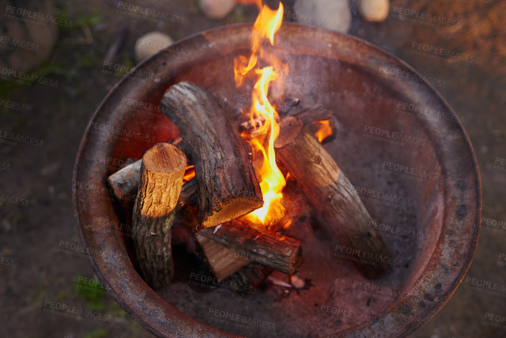 Buy stock photo Shot of logs burning in a barbeque