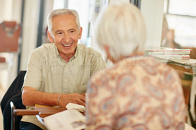 Buy stock photo Shot of a smiling senior couple taking together in a cafe