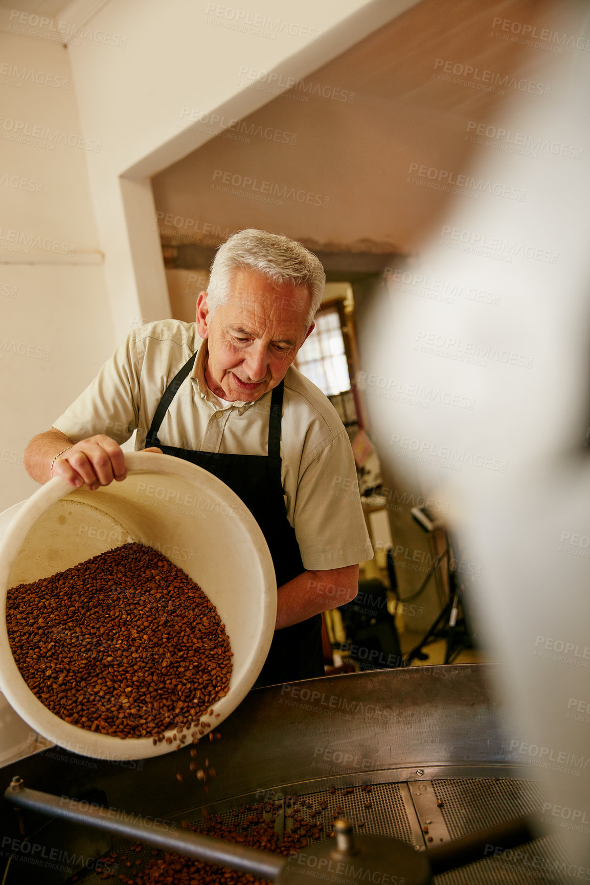 Buy stock photo Cropped shot of a senior man working in a roastery