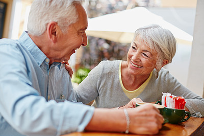 Buy stock photo Shot of a senior couple having coffee at a cafe
